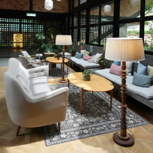 Load image into Gallery viewer, Modern living room with white armchair, gray sofa, and wooden coffee table.