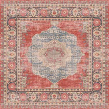 Load image into Gallery viewer, Decorative rug with a central medallion and floral patterns in red, blue, and beige.