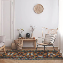 Load image into Gallery viewer, Orange vinyl mat Inspired by authenticate ethnic rugs in a small living room