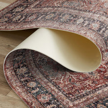 Load image into Gallery viewer, Decorative rug with intricate patterns on a wooden floor

