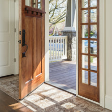 Load image into Gallery viewer, Wooden front door with glass panels open to a porch and farmhouse vinyl rug
