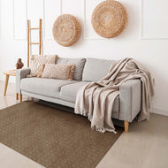 Gray sofa with beige throw blanket in a living room setting