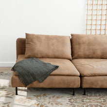 Load image into Gallery viewer, Brown sectional sofa with a green blanket on a patterned rug
