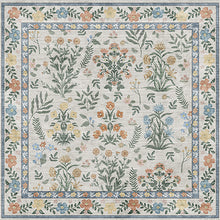 Load image into Gallery viewer, Floral patterned rug with a border on a light background
