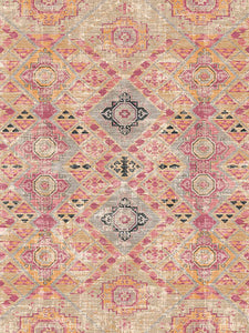 Patterned rug with geometric design in pink, beige, and black