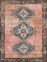 Load image into Gallery viewer, Decorative rug with geometric boho chic pattern on a pink background
