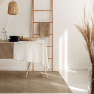 Modern interior with a table set for a meal, wooden ladder, and decorative elements and Jute vinyl rug
