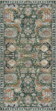 Load image into Gallery viewer, Decorative rug with intricate patterns in green, orange, and beige on a dark background
