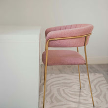Load image into Gallery viewer, Pink chair with gold legs on a patterned chair mat
