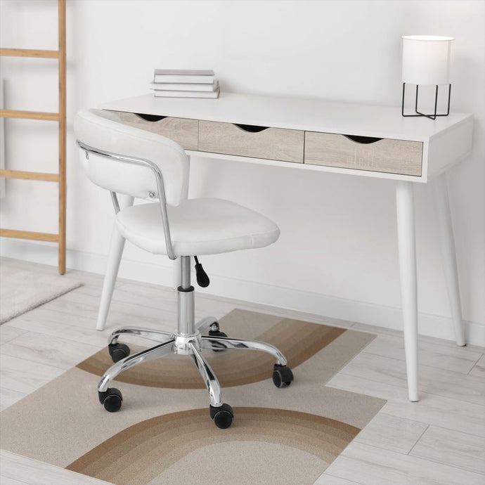 White office chair in front of a white desk with wooden accents on a light wood floor.