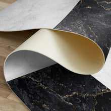 Load image into Gallery viewer, Roll of marble-patterned vinyl mat with gold and silver accents on a wooden surface.

