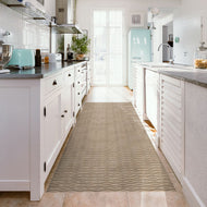 Modern kitchen with a patterned vinyl rug on the floor