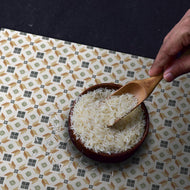 Bowl of rice on a colorful placemat