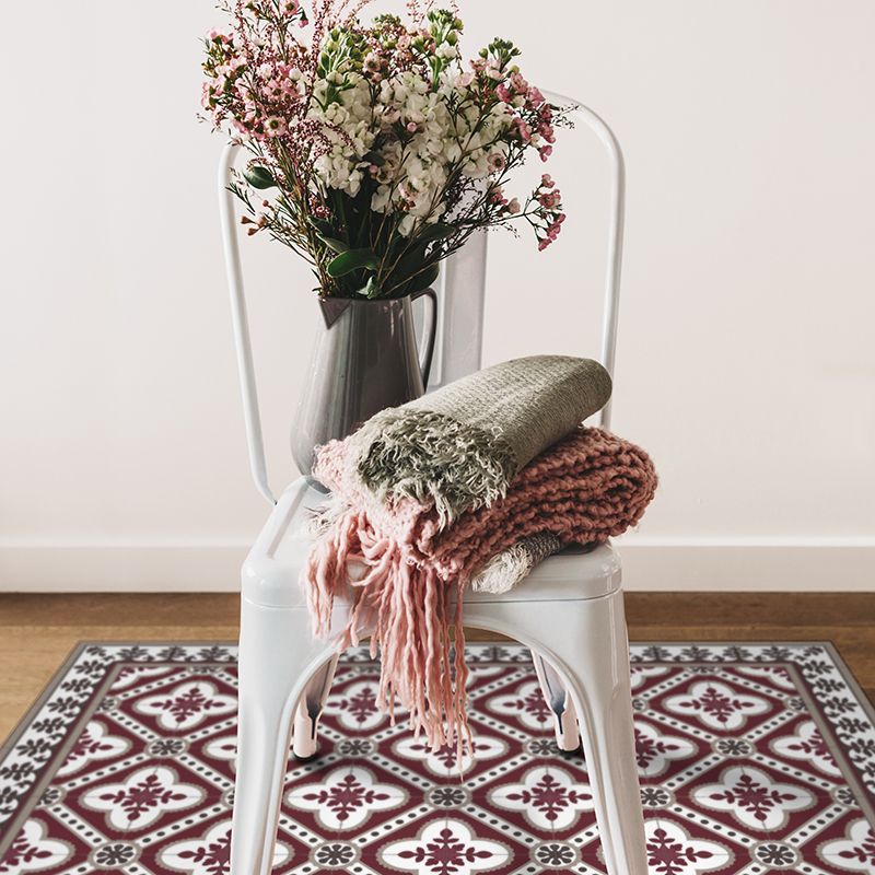 bordeaux color vinyl mat design  inspired by Spanish floor tiles under a sitting chair