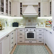 Load image into Gallery viewer, Large green vinyl mat design inspired by Spanish floor tiles - in a modern kitchen
