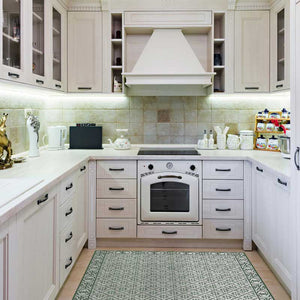 Large green vinyl mat design inspired by Spanish floor tiles - in a modern kitchen