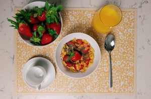 Breakfast served on colored pattern placemat