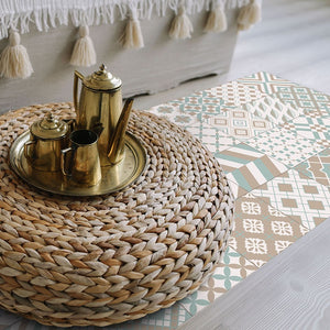 Beige patchwork vinyl mat with Spanish tile design in an oriental room