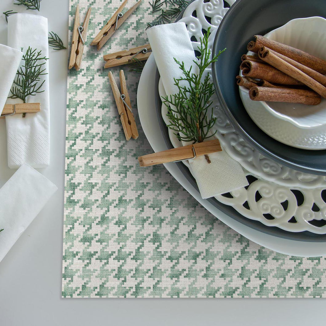Beautiful dining setting on a green pattern table runner 