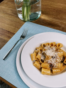 Pasta served on a light blue placemat